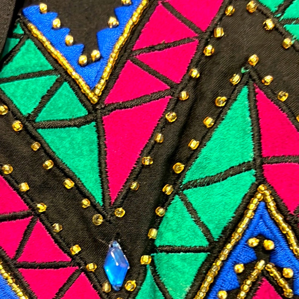 This is a Gantos unique jacket in sz 8 / stones, studs, beads throughout!